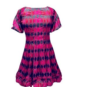 Mini dress with puffy sleeves and pleats around the whole dress